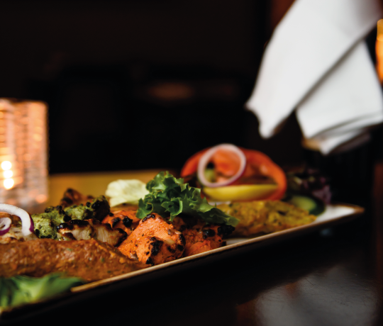 Punjabi dish garnished with salad